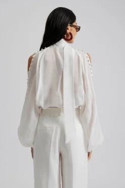 Malina Cora blus